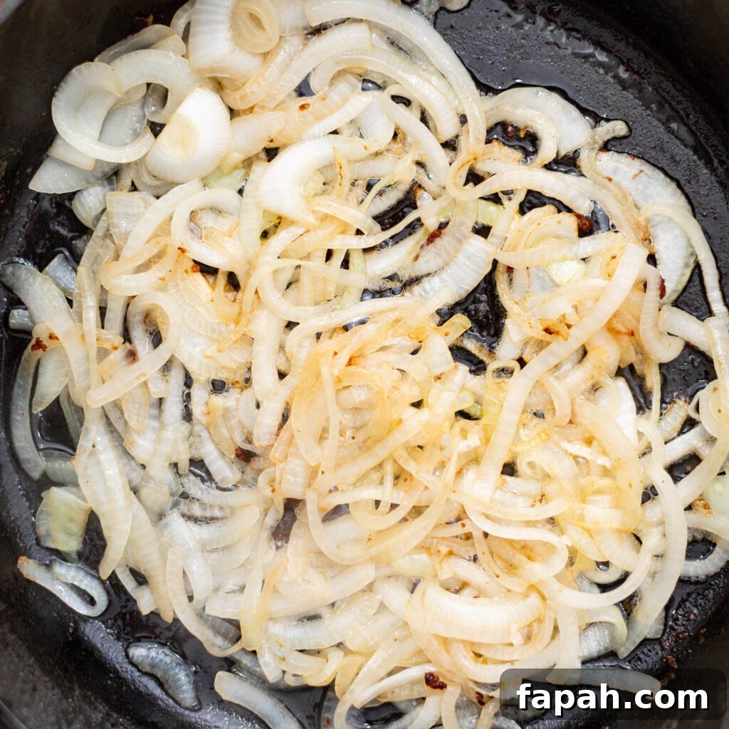 sautéing onions in a cast iron skillet