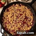 strawberry crumble in a cast iron skillet