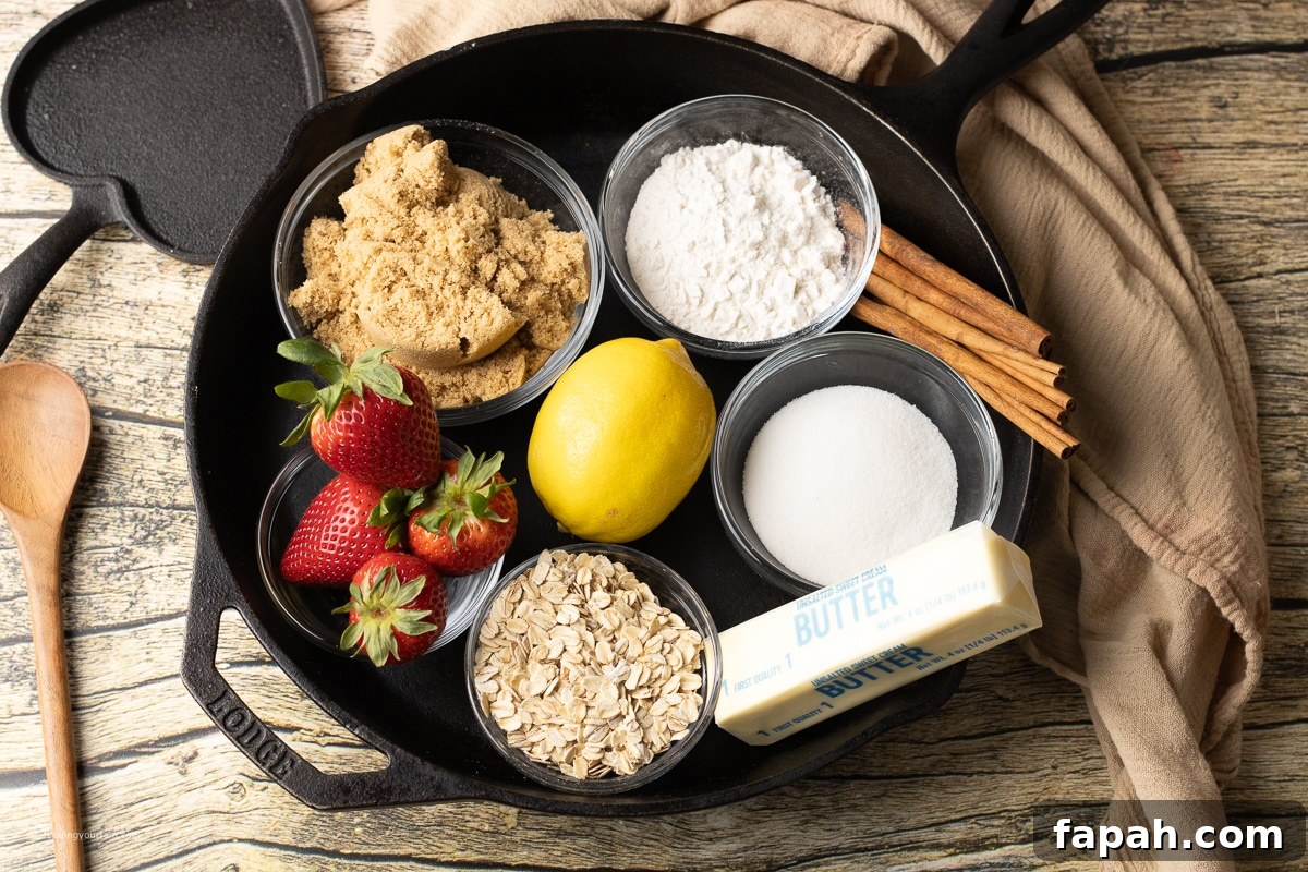 ingredients for a strawberry crisp in a skillet