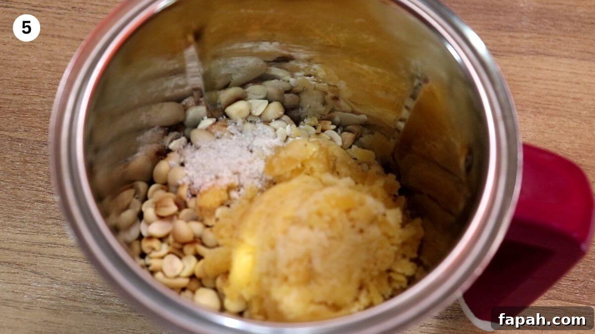 peanuts with jaggery and cardamom in a mixer.