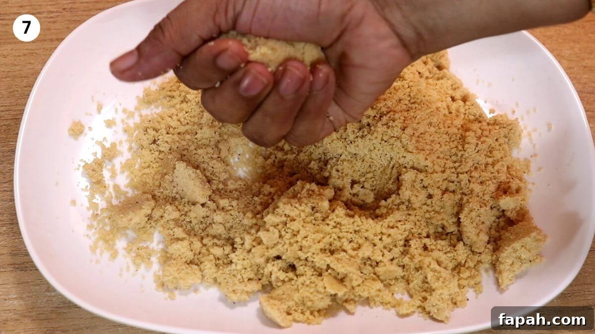 rolling the peanut jaggery mixture into ladoos.