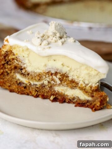 A slice of carrot cheesecake with labneh topping on a plate.