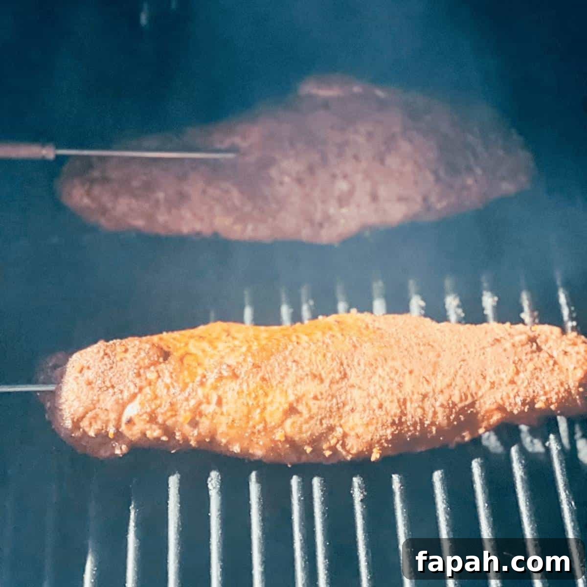 The pork tenderloins cooking on a pellet smoker.