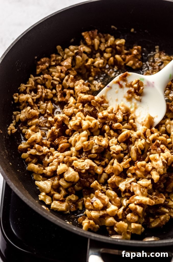 Goat Cheese Cheesecake with Roasted Honey Walnut Topping 12 Honey walnut mixture on a baking sheet.