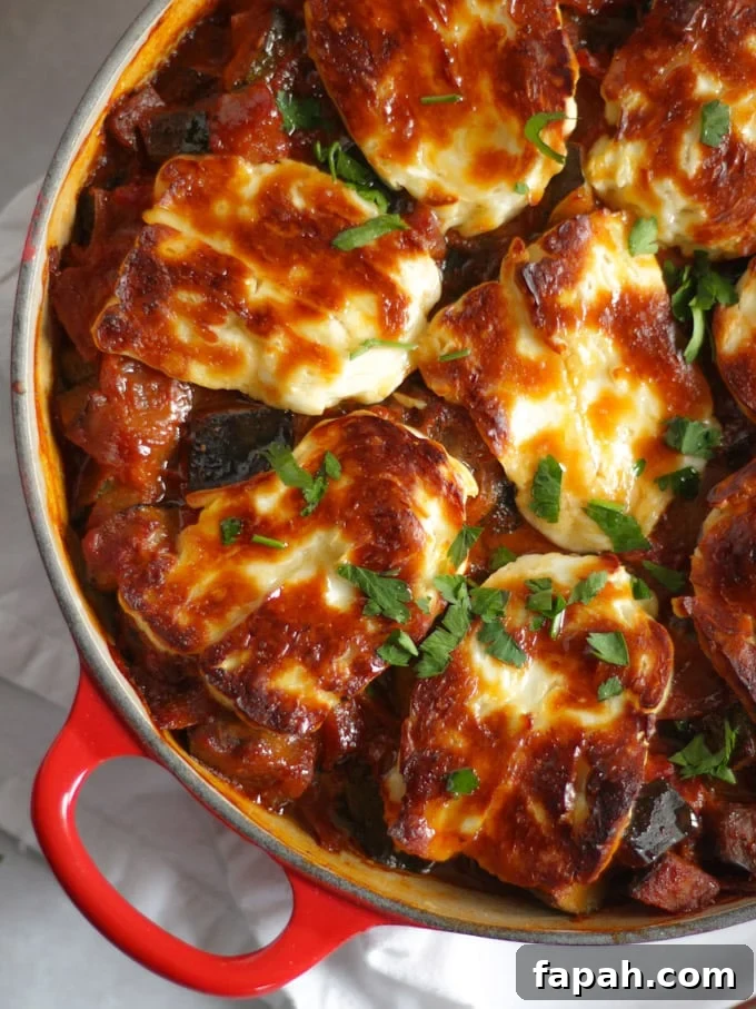 Cheese and vegetable bake recipe sprinkled with herbs.