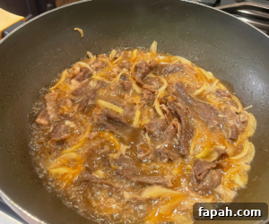 Beef cooking in sauce