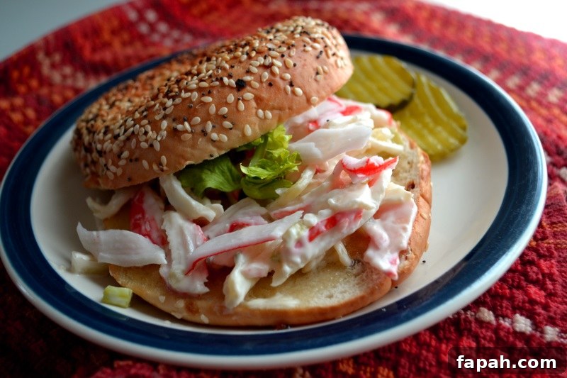 Easy Crab Salad Sandwich recipe served on a bagel from www.ApronFreeCooking.com
