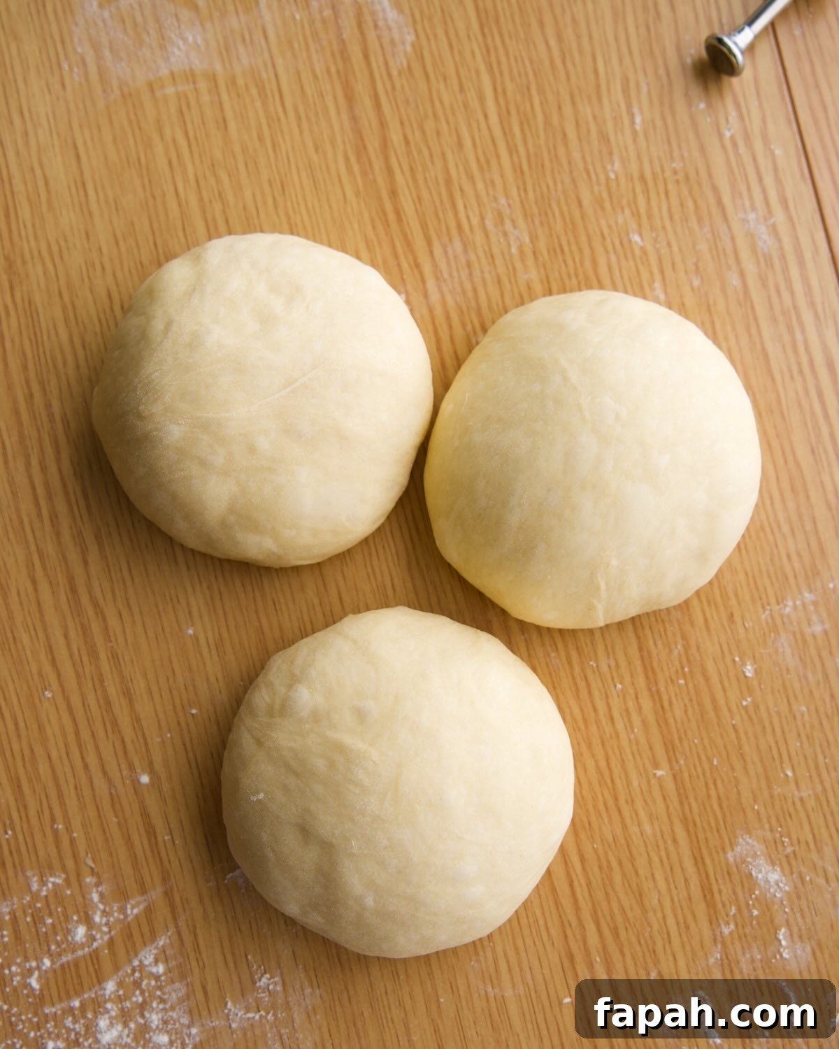 dough divided and preshaped into 3 balls