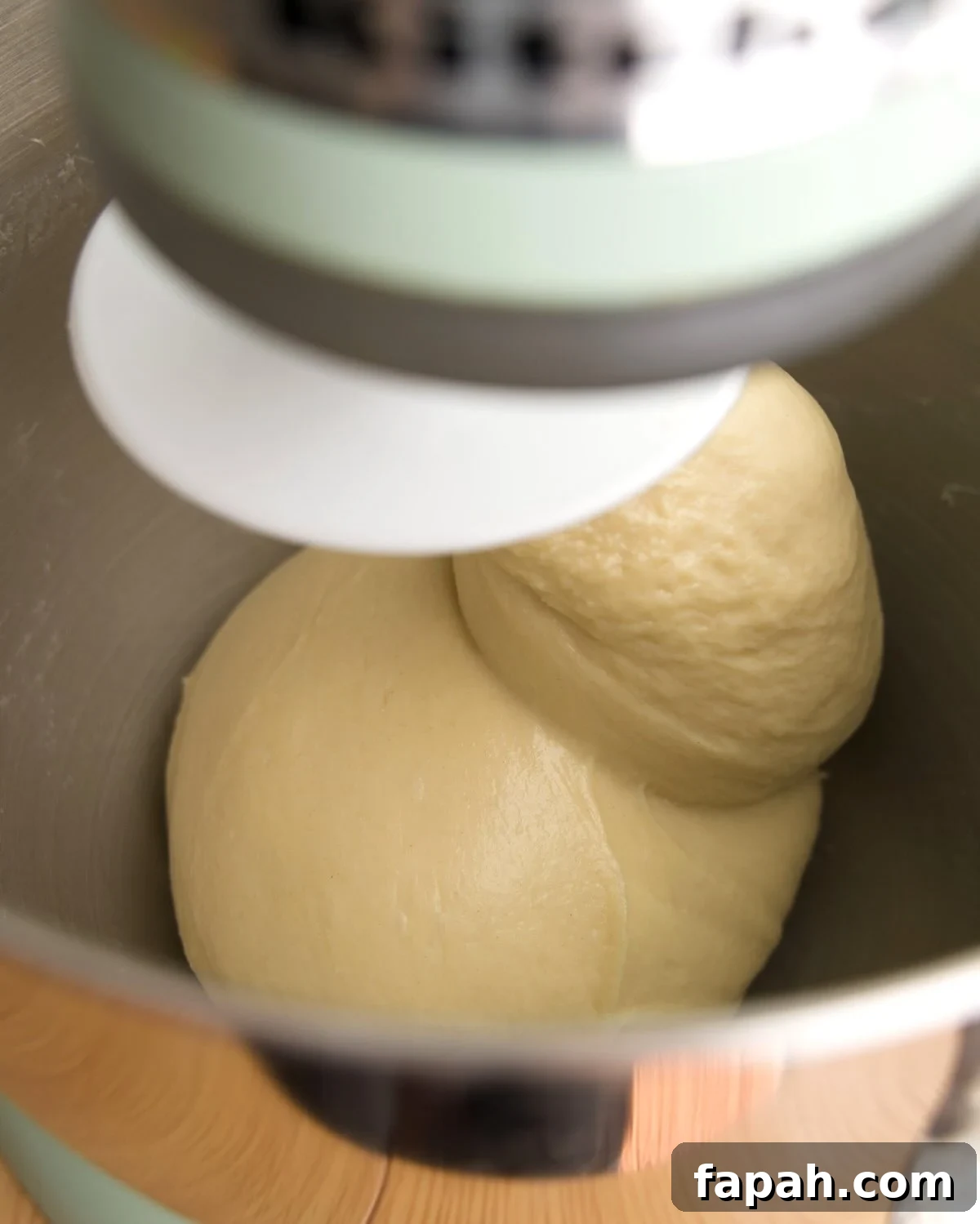 dough has formed a ball on the dough hook