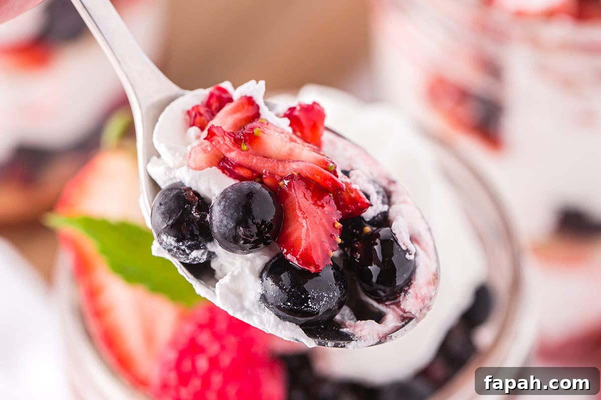 Close-up of spoonful of mixed berry shortcakes