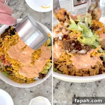 Pouring dressing over the taco salad then tossing gently.