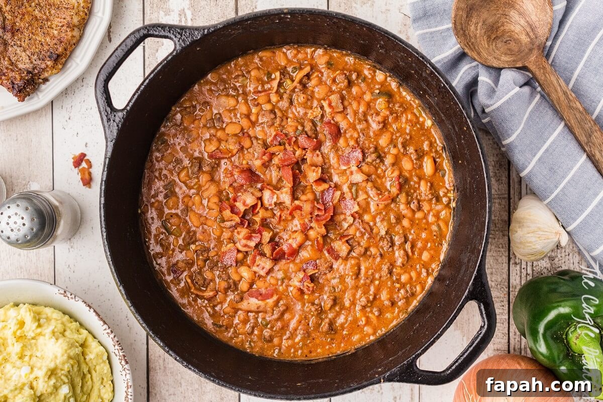 cast iron pot of baked beans with bacon