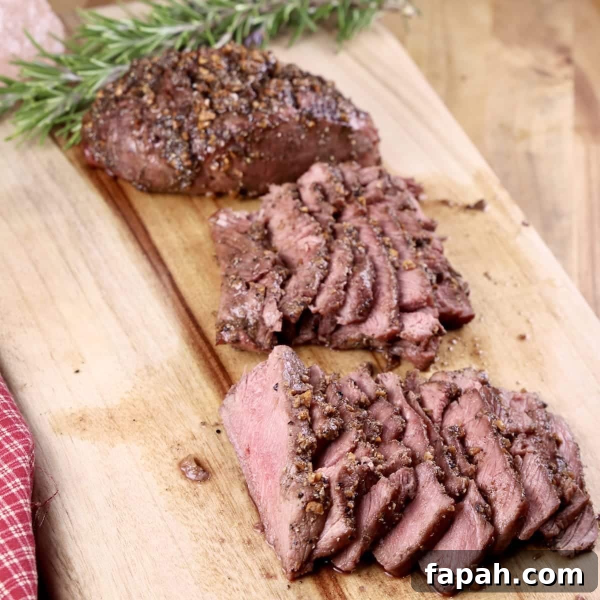 venison steak sliced and ready for eating