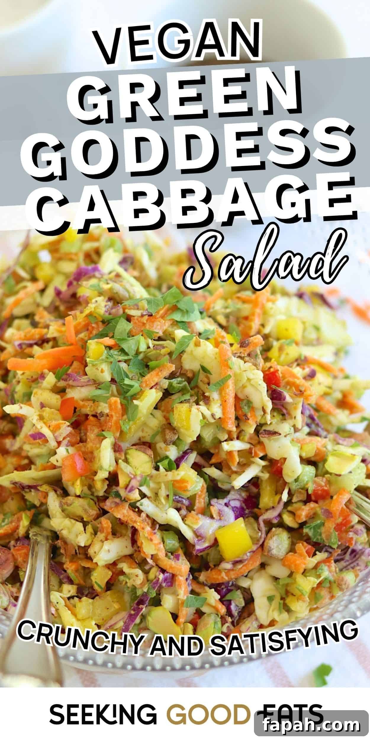 Bowl of green goddess cabbage salad with shredded cabbage, carrots, and herbs. A colorful viral green goddess salad recipe.