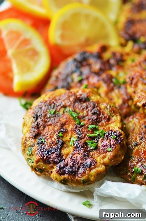 Chicken Chapli Kabab served with lemon wedges