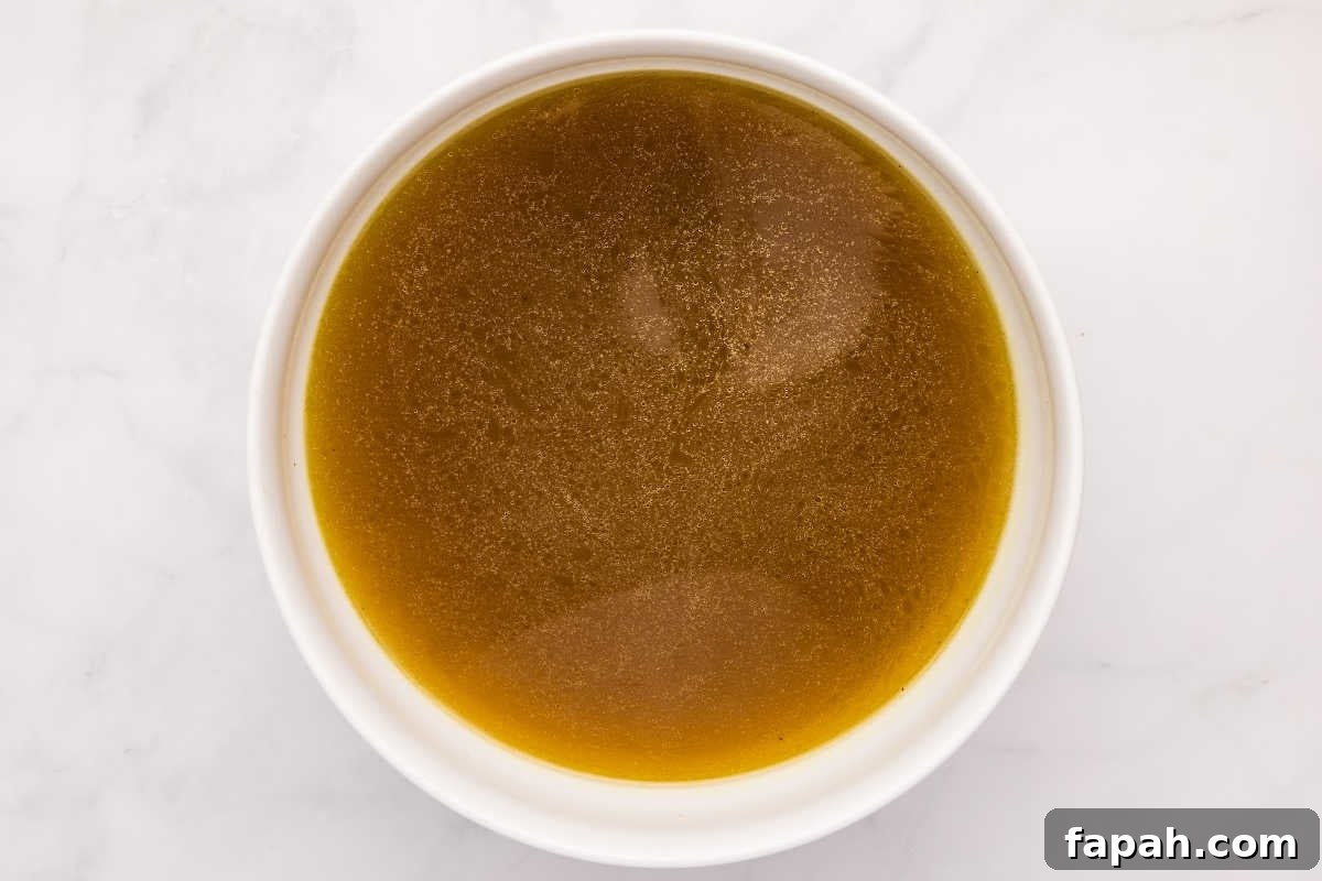 clear dark bone broth in bowl.
